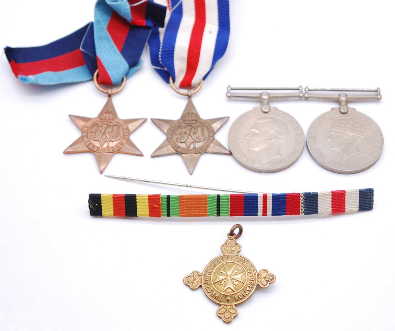 Lot 205 - A group of five medals to include 1939-1945...