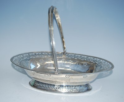 Lot 2135 - A George IV silver swing-handled cake basket,...