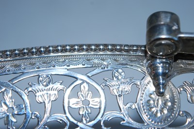 Lot 2135 - A George IV silver swing-handled cake basket,...