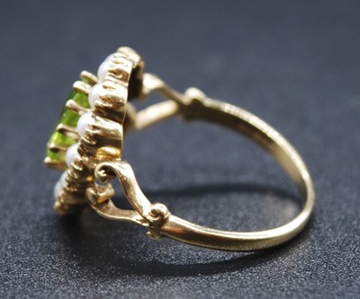 Lot 2604 - A 9ct yellow gold, peridot and pearl oval...