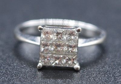 Lot 2612 - A white metal diamond square cluster ring,...