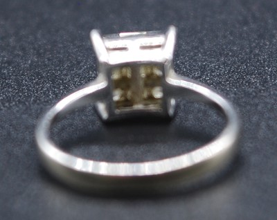 Lot 2612 - A white metal diamond square cluster ring,...