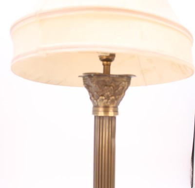 Lot 6 - A modern brass table lamp, in the form of a...