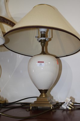 Lot 11 - A 20th century brass table lamp in the form of...