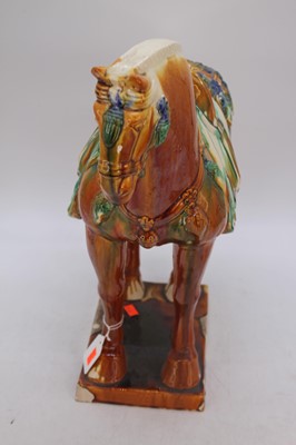 Lot 24 - A Chinese Tang style sancai glazed earthenware...