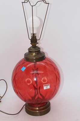 Lot 27 - A 20th century red glass table lamp, of...