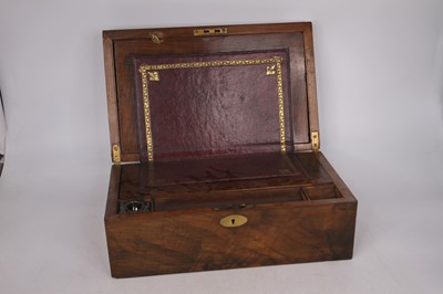Lot 38 - A Victorian walnut writing slope, the lid...