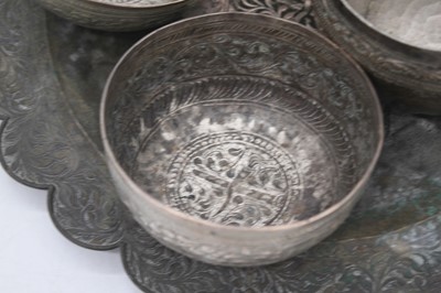 Lot 47 - A collection of Eastern repousse decorated...