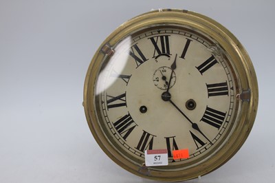 Lot 57 - A brass ship's clock, the dial showing Roman...