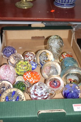 Lot 82 - A collection of glass paperweights, to include...