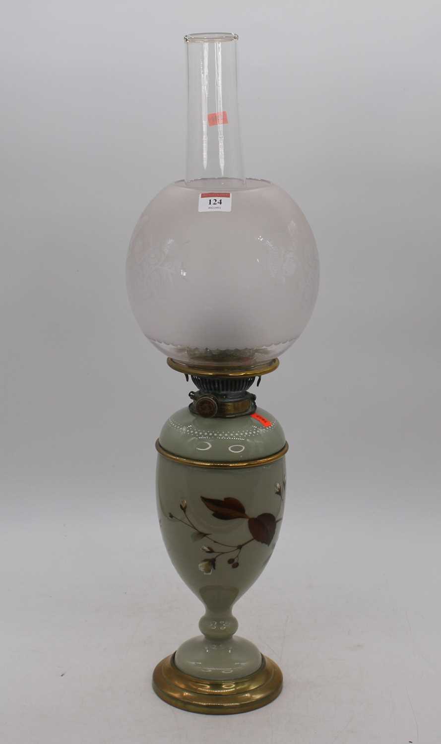 Lot 124 - A Victorian green glass oil lamp, the acid...