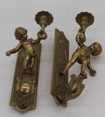 Lot 129 - A pair of brass figural wall sconces, h.30cm