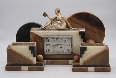 Lot 131 - An Art Deco figural clock garniture, the...