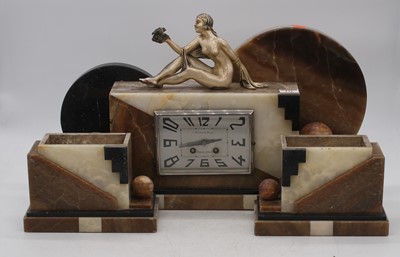 Lot 131 - An Art Deco figural clock garniture, the...