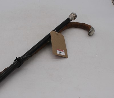 Lot 142 - A Victorian ebonised walking stick, having...