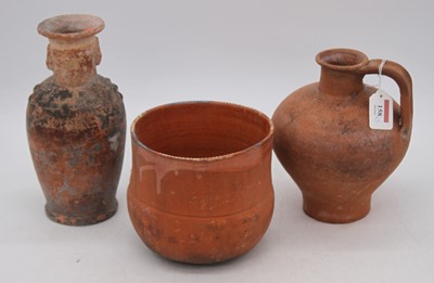 Lot 158 - An antique earthenware cooking pot, having...