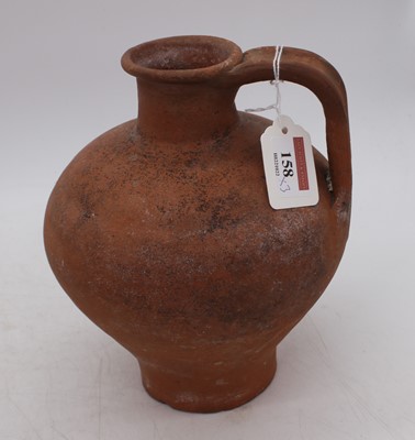 Lot 158 - An antique earthenware cooking pot, having...