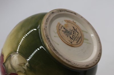 Lot 202 - A Moorcroft pottery Hibiscus pattern bottle...