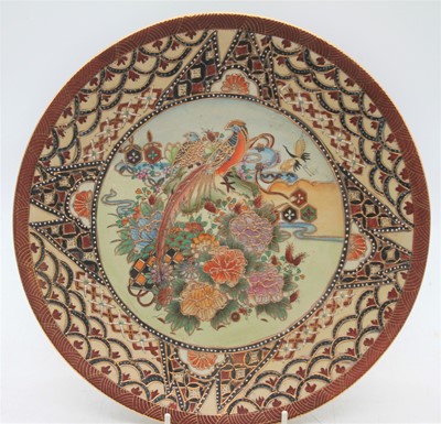 Lot 114 - A Japanese satsuma plate, decorated with a...