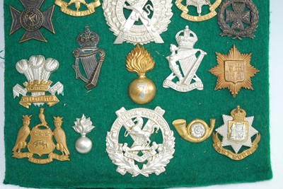 Lot 70 - A collection of British Army cap badges and...
