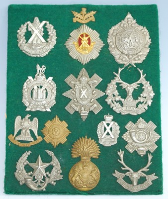 Lot 65 - A collection of cap badges and insignia,...