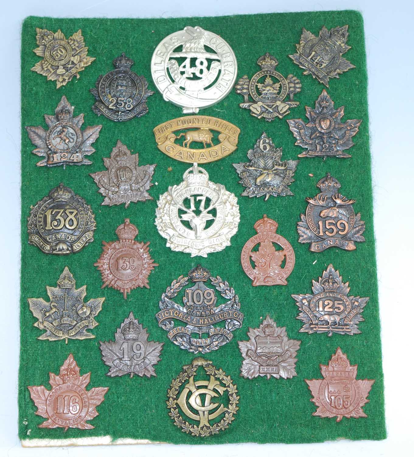 Lot 66 - A collection of cap badges and insignia, being...