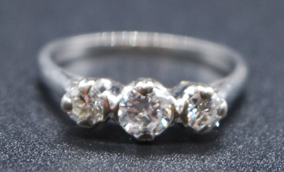 Lot 2618 - A white metal diamond three stone ring,...