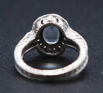 Lot 2622 - A white metal, aquamarine and diamond oval...