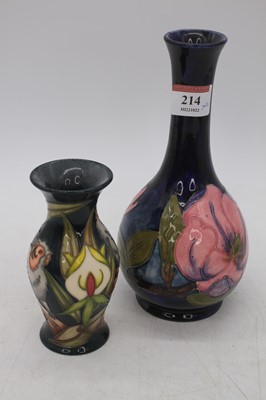 Lot 214 - A Moorcroft Magnolia pattern bottle vase, h.21....