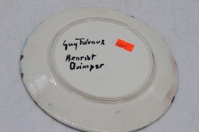 Lot 220 - A set of four Guy Trevour Quimper plates, each...