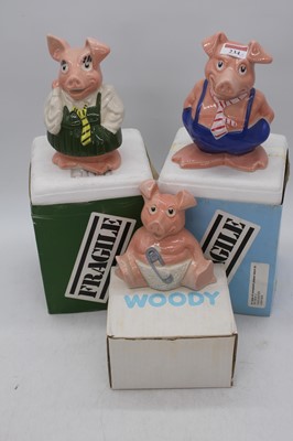 Lot 234 - A set of three Wade Natwest piggy-banks, the...