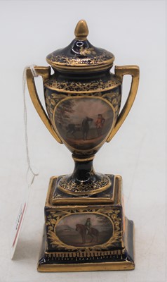 Lot 209 - A 19th century hand-painted porcelain urn, h.13cm