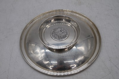 Lot 246 - A white metal dish, inset with a Deutschemark...