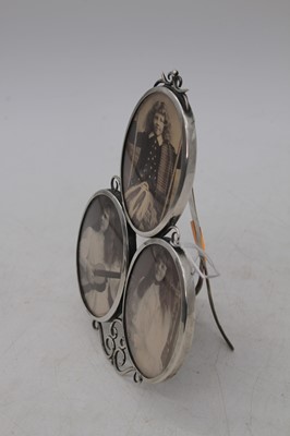 Lot 247 - A Victorian silver easel three-photograph...