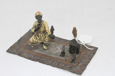 Lot 250 - A cold-painted metal figure of an...