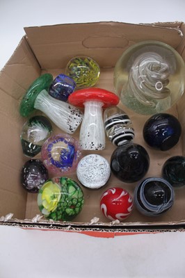 Lot 260 - A collection of sixteen glass paperweights,...