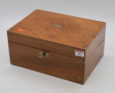 Lot 267 - A Victorian walnut writing slope, the lid...