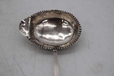 Lot 294 - A Georgian silver toddy ladle, having ebonised...