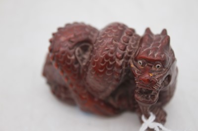 Lot 308 - A reproduction carved netsuke in the form of a...