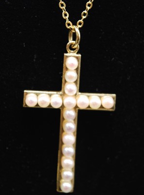 Lot 2703 - A yellow metal pearl set cross pendant,...