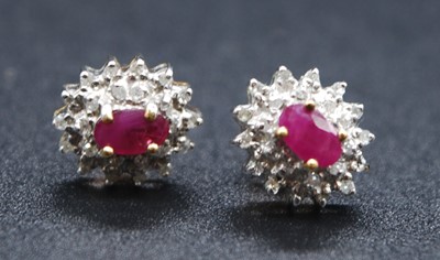 Lot 2705 - A pair of yellow and white metal, ruby and...