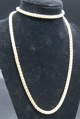 Lot 2699 - A 9ct yellow gold braided curblink neck chain,...