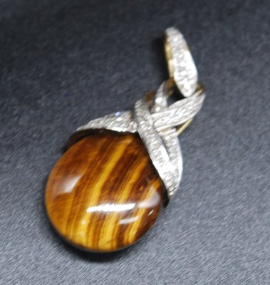 Lot 2696 - A yellow metal, diamond set tiger's eye...