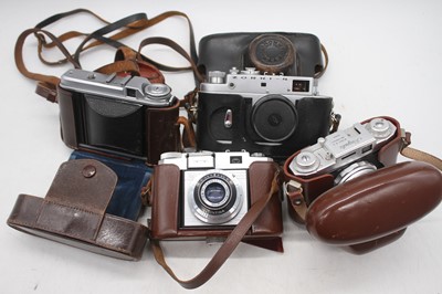 Lot 311 - Four vintage cameras, to include a Zeiss...