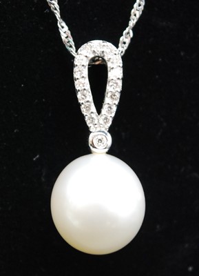 Lot 2628 - An 18ct white gold, pearl and diamond pendant,...
