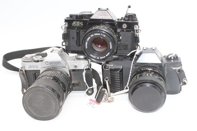 Lot 317 - A Canon AT-1 SLR camera, serial #584927,...