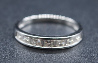 Lot 2707 - An 18ct white gold diamond half eternity ring,...