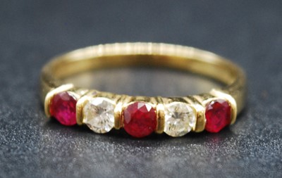 Lot 2708 - An 18ct yellow gold, ruby and diamond half...