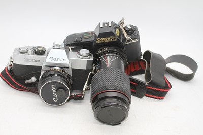 Lot 320 - A Canon EX-auto SLR camera, serial #172691,...