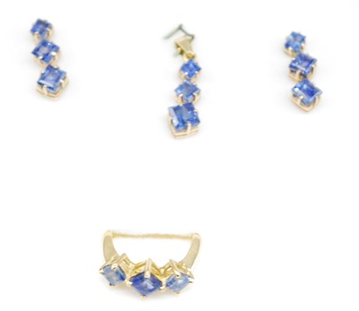 Lot 2709 - A yellow metal sapphire suite of jewellery,...